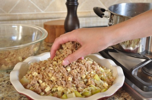 Sprinkling on the crumble topping