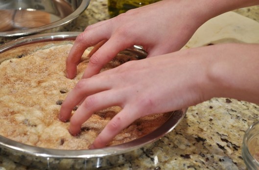 Dimpling the focaccia dough