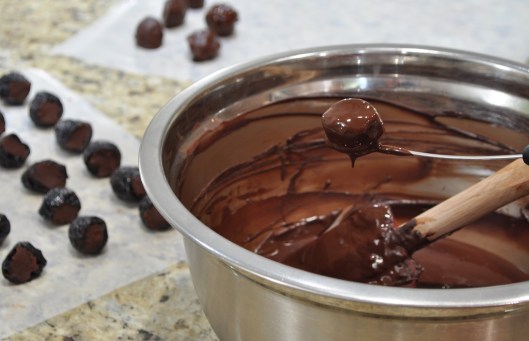 Dipping the prunes in chocolate