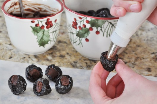 Filling the prunes with ganache