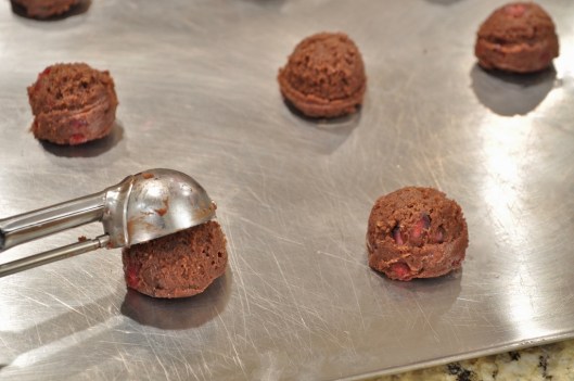 Scooping pomemgranate brownie cookies