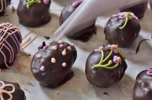 Piping designs on coconut Easter egg candy