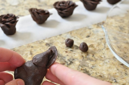 Press base of petal against center