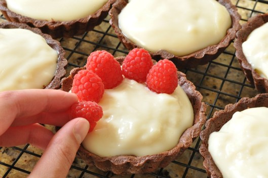 Place Raspberries on the Chocolate-Cointreau Tarts